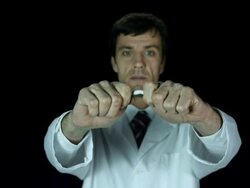 HD Super Slow-Mo: Doctor Breaking A Cigarette Stock Footage