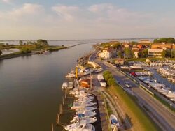 Aerial flight over harbor in Po river delta Stock Footage