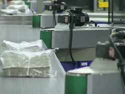 CU Shot of Newspaper bundle at newspaper printing office / Russelheim, Hesse, Germany Stock Footage