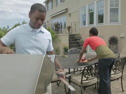 MS Couple drinking juice in back yard  / Portland, Oregon, United States  Stock Footage
