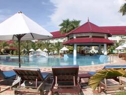 MS Shot of Lounge chairs along pool at luxury resort / Sihanoukville, Cambodia Stock Footage