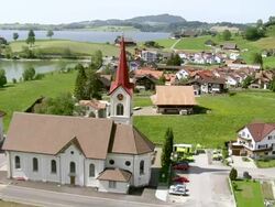 WS AERIAL View of village with lakeside of Lake Sihl / Willerzell, Schwyz, Switzerland Stock Footage