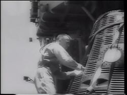 B/W 1961 Alan Shepard looking in doorway of Mercury 3 space capsule after flight Stock Footage