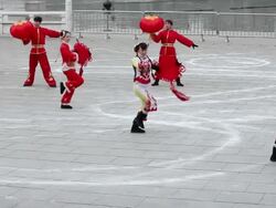 MS PAN Performer dressed traditional chinese clothing and performing with Chinese knot and red lan tern during chinese spring festival in Tang Paradise  AUDIO  / xi'an, shaanxi, china Stock Footage