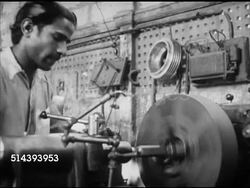 1953: PAKISTAN: INDUSTRY: VS Men working, sanding or polishing item by hand, table leg shape. VS Men working w/ horizontal lathe, boring, shaping or making copy of shape.   Pakistani, Indian. Instructional Video
