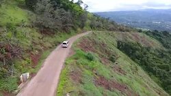 An ambulance travels along a dirt road Stock Footage