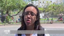 VOICED : Brasilenos lamentan una crisis economica News Clip