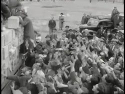 A group of men throw food to a crowd of people on May 12, 1949 in Berlin, Germany. News Clip