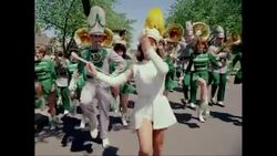 MS Performers marching in parade on street during carnival / United States Stock Footage