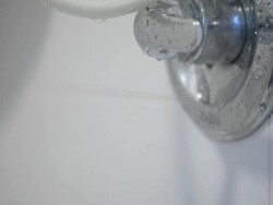 Turning on the Shower Stock Footage