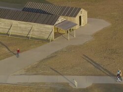MS AERIAL Shot of People walking near Kitty Hawk Wright Brothers Memorial / North Carolina, United States Stock Footage
