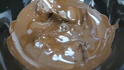 melting dark chcolate. close up. Slow motion. Stock Footage