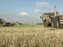 HMMWV and tanks in summer field Stock Footage