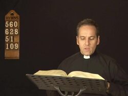 Vicar / Priest reading The Bible Stock Footage