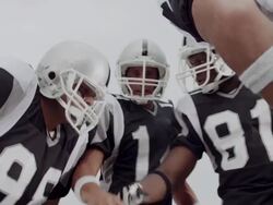 CU, LA, American football players in huddle, Staten Island, New York, USA Stock Footage