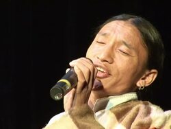 CU Man singing song on stage AUDIO / Dharamsala, Himachal Pradesh, India Stock Footage