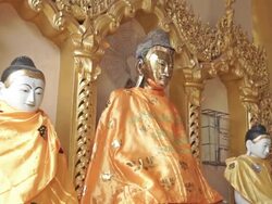 Vibrant statutes of religious figure in a monestary in Yangon, Myanmar Stock Footage