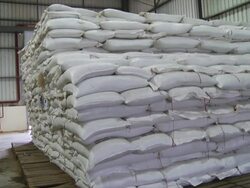 MS PAN Shot of bags of Pilsen malt piled high on pallet / Wau, Western Bahr el Ghazal, Sudan  Stock Footage