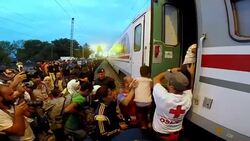 CLEAN : Chaos in Croatia as migrants swarm departing trains News Clip