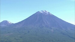 Snow covers the top of a volcano on the Kamchatka Peninsula. Stock Footage