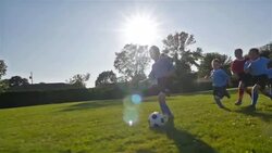 Children playing soccer Stock Footage