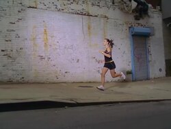 MS POV SLO MO ZO ZI Girl jogging with ipod and earphone on pathway /New York, New York, United States Stock Footage