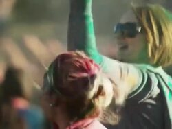 young people covered in colored powder and celebrating Stock Footage