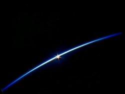 Sun on horizon at high latitude, satellite shot, STS-42 Stock Footage