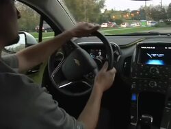 MS POV ZO Driver behind wheel of electric car / Rochester, Michigan, United States Stock Footage