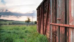 Time lapse view of sun rising above prairie dwelling Stock Footage