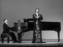 1951 Wide shot Marian Anderson singing Ave Maria onstage next to pianist during performance/ USA  Stock Footage