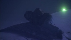 An injured man curls up in a blizzard on top of a plane after it crashed. Stock Footage