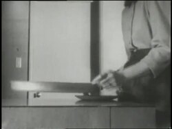 A housewife demonstrates a floating frying pan in a futuristic kitchen in 1954. News Clip