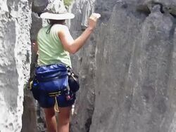HD video woman hikes through Ankarana Reserve Tsingy rocks Madagascar Stock Footage