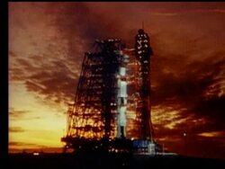 low angle wide shot of Apollo 16 rocket on launch pad at dawn Stock Footage