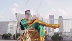 Superhero reading newspaper on city rooftop Stock Footage
