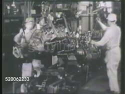 1942: JAPAN: INDUSTRY: WS Automobile factory. INT VS Factory workers working w/ engines, operating drill, operating machinery, incomplete truck driving off factory line. Home front, production, war machine Instructional Video