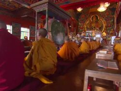 MS PAN Boys chanting prayers in their red and yellow robes in worship hall  AUDIO / Kathmandu, Central Region, Nepal  Stock Footage