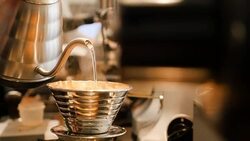 Hot water is being poured into coffee dripper Stock Footage