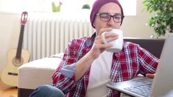 Young man working on lap top at home Stock Footage