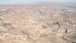 Craggy ravines and rugged mesas characterize the Fish River Canyon in Namibia. Stock Footage