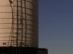Maintenance ladders scale a small water tower high above a New York City neighborhood. Stock Footage
