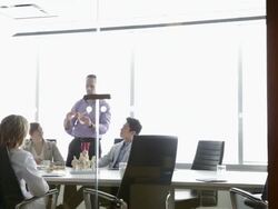Doctors discussing anatomical model in conference room Stock Footage