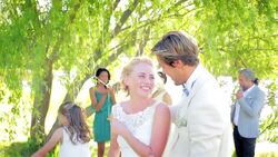 Bride and groom smiling and hugging at wedding reception Stock Footage
