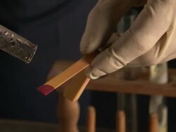 Drops of clear liquid falling onto litmus paper which turns red, indicating that the liquid is acidic, UK (sound available) Stock Footage