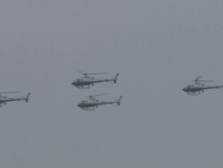 HD: Military, Police, Security Helicopters Flying in Formation Past Masts Stock Footage
