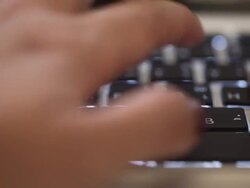 Hand typing a laptop computer Stock Footage