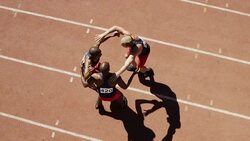 Portrait of male runners celebrating on track Stock Footage