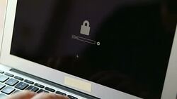 Computer hacker stealing data from a laptop Stock Footage