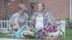 HD: Lesbian Couple Gardening In A Backyard. Stock Footage